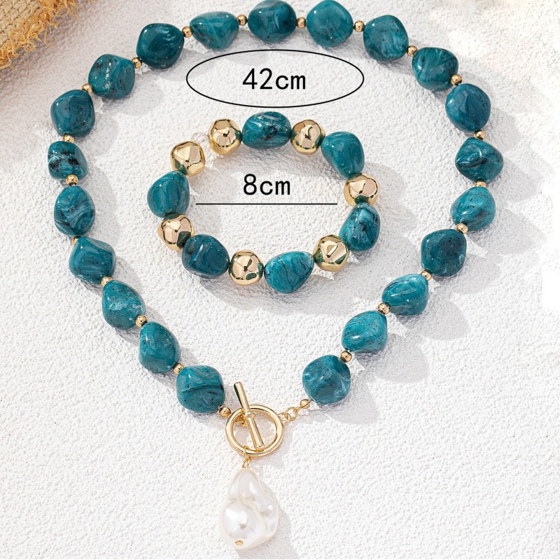Set de colgante y pulsera con piedras semipreciosas y perla de agua
